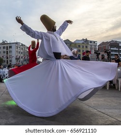 ISTANBUL, TURKEY - JUNE 03, 2017: Semazens (dervishes) is dancing Ramadan and people waiting the evening meal (iftar) food near the Zeytinburnu, Istanbul, Turkey.
