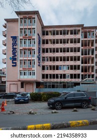 Istanbul, Turkey - Mar 16, 2022: Portrait View Of Universal Aksaray Hospital Building Exterior In Fatih City With Cars Parking On The Sidewalk, Which Was Permanently Closed.