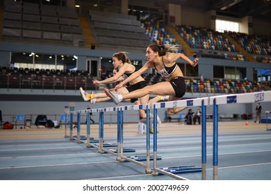 ISTANBUL, TURKEY - MARCH 07, 2021: Athletes running 60 metres hurdles during Turkish Athletic Federation Combined Track and Field Competitions Championships