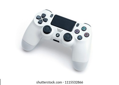 ISTANBUL, TURKEY - MARCH 12, 2018: The new Sony Dualshock 4 white color is on the white background. Sony PlayStation 4 game console of the eighth generation.