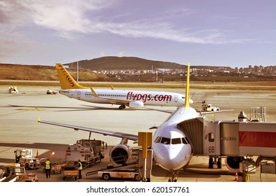 Istanbul, Turkey - March 17, 2017: Two Pegasus Airlines boeing airplanes are on the Sabiha Gokcen Airport.One of them ready for flying and the other one boarding passengers 