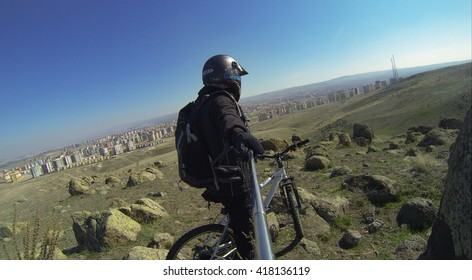 Istanbul, Turkey - March 22, 2014: Man Preparing For Downhill With His Mountain Bike Gopro Image