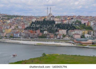 Istanbul, Turkey - May 05, 2009: View of the Golden Horn with the Asian side of the city with a mosque standing out among the houses in the background