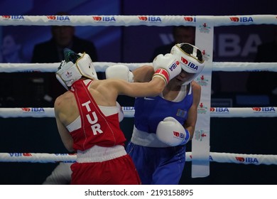 ISTANBUL, TURKEY - MAY 19, 2022: Cagirir Ayse (Red) And Balkibekova Alua (Blue) Compete During IBA Womens World Boxing Championships