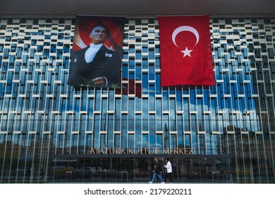 Istanbul, Turkey, May 19th 2022: Two Women Walk In Front Of The Atatürk Cultural Center On Taksim Square, Istanbul, On The Commemoration Of Atatürk, Youth And Sports Day. 