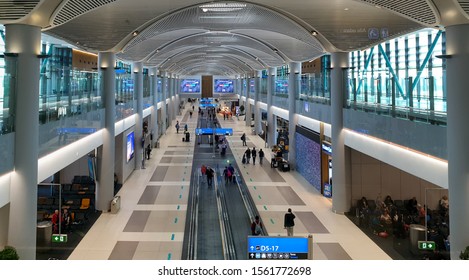 Istanbul, Turkey - November 15, 2019:  Istanbul New Airport IST Airport. Panoramic Aerial View Of New ISL Largest Airport Terminal Interior. Departure And Arrival Areas. People Walk In Modern Airport.