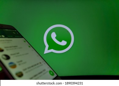 Istanbul, Turkey - November 2020: chat screen of aplication on mobile android device in front of the whatsapp logo. privacy and security rumors about Whatsapp named mobile communication application