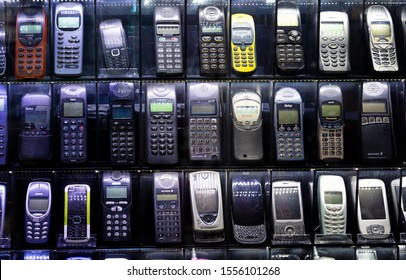 ISTANBUL, TURKEY, NOVEMBER 8, 2019: Old mobile phones on a technology market showcase. Cell phones from the early 2000's.
