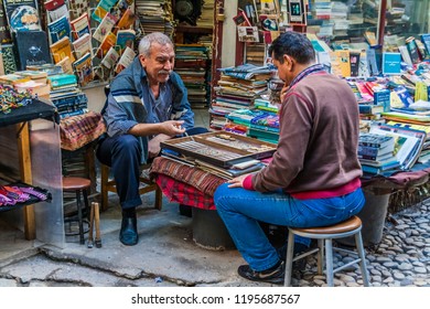 Istanbul, Turkey, October 1, 2011: Two Men Sitting In A Street Playing Backgammon.