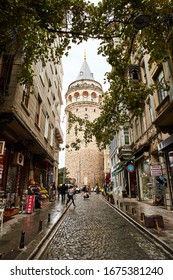 ISTANBUL, TURKEY - OCTOBER 11, 2019: Galata Kulesi Tower and street in the old city. Ancient Turkish famous landmark in Beyoglu district, European side. Architecture of the former Constantinople.