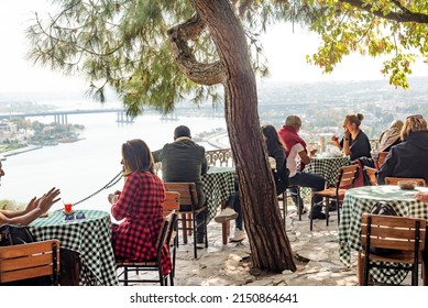 Istanbul, Turkey. October 12th 2021
People Enjoy Turkish Tea And Coffee And A View Of The Golden Horn From The Famous Pierre Lotti Cafe In The Eyup District Of Istanbul, Turkey. 
