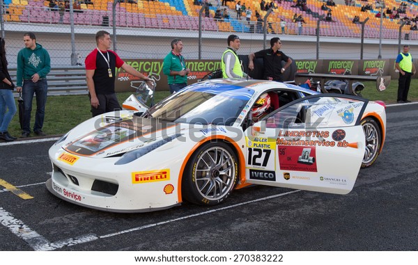 ISTANBUL, TURKEY - OCTOBER 25, 2014: Baron\
Service Racing Team driver Tommy Lindroth in start line during\
Ferrari Racing Days in Istanbul Park Racing\
Circuit