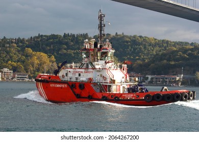 ISTANBUL TURKEY OCTOBER 26, 2021, Coastal Safety Ship, Salvage, Search And Rescue Boat Navy Coast Guard Ship, Patrol Vessel Passing Istanbul Strait, Bridge And City Forest View At Background 