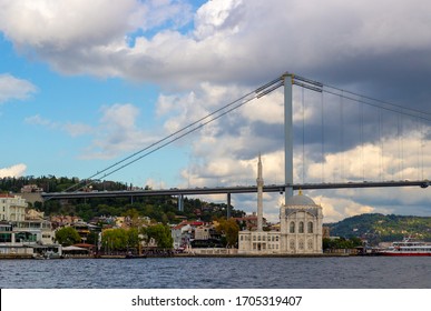 Istanbul, Turkey – October 6, 2019: View On Ortakoy Mosque (Grand Imperial Mosque Of Sultan Abdülmecid) And Bosphorus Bridge (the 15 July Martyrs Bridge) From Bosphorus Strait In Istanbul, Turkey