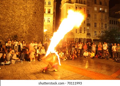 ISTANBUL, TURKEY - SEPTEMBER 05: A Street Performer Blows Fire During Street Shows In Galata Square On September 05, 2010 In Istanbul, Turkey