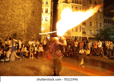 ISTANBUL, TURKEY - SEPTEMBER 05: A Street Performer Blows Fire During Street Shows In Galata Square On September 05, 2010 In Istanbul, Turkey