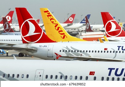 Istanbul, Turkey, September 2014 - Pegasus airlines and Turkish airlines airplanes waiting on a terminal on Ataturk international airport