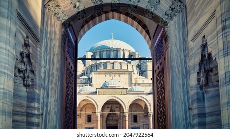 Istanbul, Turkey - September 2021: Suleymaniye Mosque architecture details with dome and entrance door. Suleymaniye mosque is built by Mimar Sinan during Ottoman Empire era.