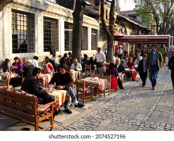 ISTANBUL, TURKEY-04.03.2010: Turkish People Enjoying Tee And Coffee In Leisure Time At A Street Cafe, In Sultan Ahmet Square, In Istanbul, Turkey, Asia.         