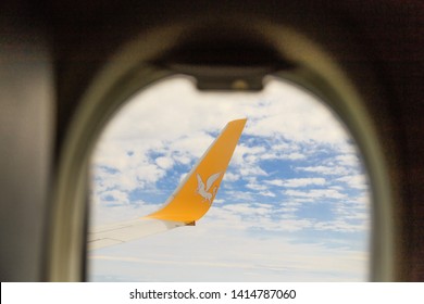 Istanbul, Turkey-may 04, 2019: International Airport Sabiha Gökçen International Airport,yellow Wing Passenger Aircraft In Flight In The Clouds, Pegasus Airline, Logo With A Horse