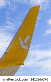 Istanbul, Turkey-may 04, 2019: International Airport Sabiha Gökçen International Airport,yellow Wing Passenger Aircraft In Flight In The Clouds, Pegasus Airline, Logo With A Horse