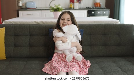 Istanbul,Turkey - 04.22.2022:A Little Girl Hugs Her Favorite Toy. A Child Is Playing With A Teddy Bear, Talking To Him.