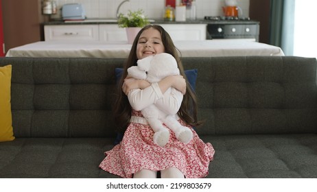 Istanbul,Turkey - 04.22.2022:A Little Girl Hugs Her Favorite Toy. A Child Is Playing With A Teddy Bear, Talking To Him.