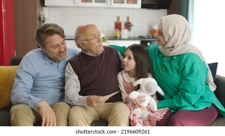 Istanbul,Turkey - 22.04-2022: 70s Old Man And His Family Looking At Old Photos. Senior Man In Glasses Looking At Old Photo Album, 3 Generations Side By Side.