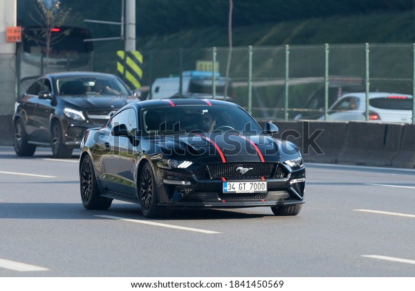 ISTANBUL/TURKEY - OCTOBER 20, 2020: Black Ford\
Mustang GT on the\
highway.