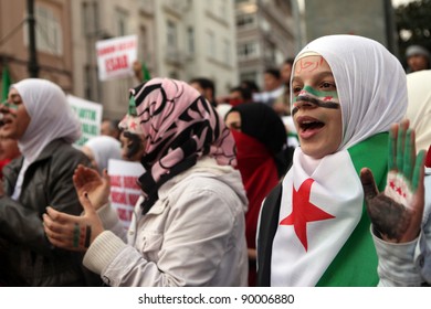 ISTANBUL,TURKEY-DECEMBER 2: Unidentified Syrians living in Istanbul protest the regime of Bashar Essad in front of Syrian Consulate on December 2, 2011 in Istanbul,Turkey.