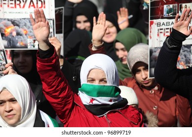 ISTANBUL,TURKEY-MARCH 2:A group of unidentified people stage a demonstration in front of the Beyazit Mosque, protesting Syrian authorities' violent crackdown in Homs,on March 2,2012 in Istanbul,Turkey