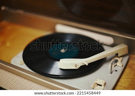 Istra, Russia - September 06, 2021: Vinyl record, spinning on a turntable, Vintage record player with radio 60's.