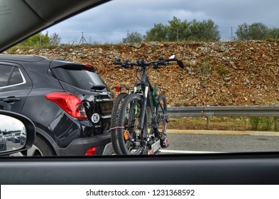 Istria, Croatia. August 2018. On The Highway A Car Equipped With A Bike Carrier, On Board Two Modern Mountain Bikes.