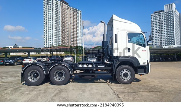 Isuzu truck, tractor head GXZ360, new LED headlight\
set with Leveling Switch, high-low level adjustment that just\
launched in May Parked in the parking lot - Thailand, Chiang Mai,\
27 July 2022