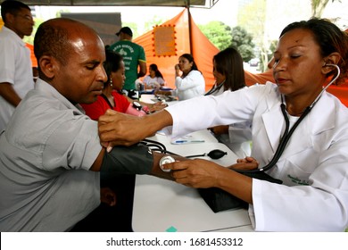 Itabuna, Bahia / Brazil - November 30, 2011: A Person Is Seen Taking A Blood Pressure Measurement During A Health Fair In The City Of Itabuna.