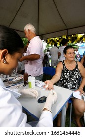 Itabuna, Bahia / Brazil - November 30, 2011: A Person Is Seen Collecting Blood From A Patient During A Health Fair In The City Of Itabuna.