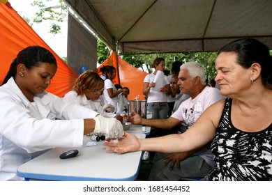 Itabuna, Bahia / Brazil - November 30, 2011: A Person Is Seen Collecting Blood From A Patient During A Health Fair In The City Of Itabuna.