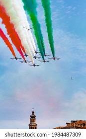 Italian aerobatic display team (frecce tricolori) fly over Venice with seagulls