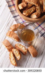 Italian almond biscotti cookies and wine on the table. Vertical top view