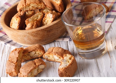 Italian almond biscotti cookies and wine close-up on the table. Horizontal