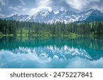 italian alps dolomites national park lake mountain trekking peaks tre cime brais lake carezza lake reflection clouds