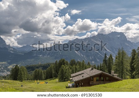 Similar – Foto Bild Young woman on the balcony who enjoys the view of the mountains