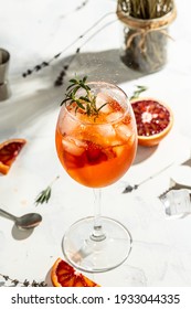 Italian Aperol Spritz Cocktail With With Bloody Oranges, Red Bitter, Dry White Wine, Soda, Zest And Ice. Summer Drink.