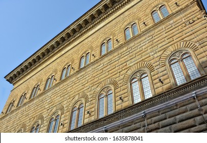 Italian architecture. Ancient stone building with arch windows and medieval glass. Old town. Historical landmarks. Italy. Tuscany. Florence – April 04, 2018 