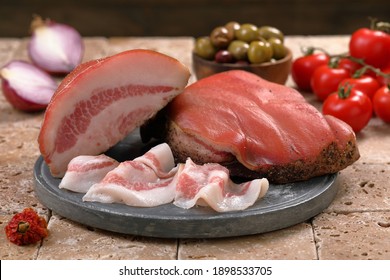 Italian bacon salted pork cheek on chopping board