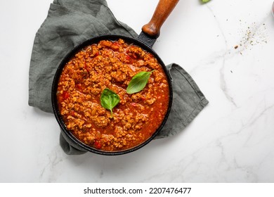 italian bolognese sauce in saucepan for pasta top view cooking food