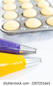 Italian Buttercream Batter In A Piping Bag With Metal Jumbo Cupcake Tips.