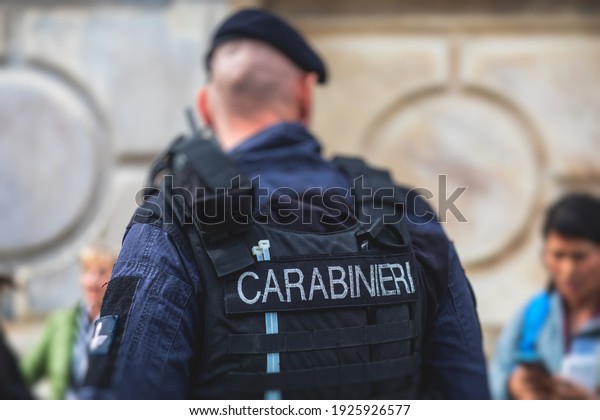Italian Carabinieri, national gendarmerie of Italy\
squad,  of Italy patrol formation back view with \