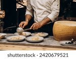 Italian chef preparing spaghetti with sauce