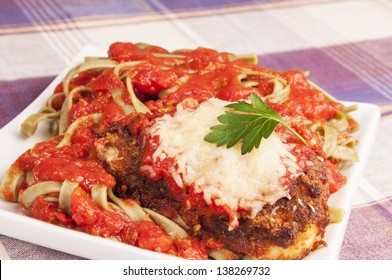 Italian Chicken Parmesan Or Parmigiana In Spaghetti Souse